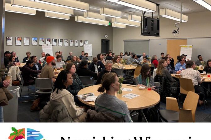 A room of people at Madison College with the Nourishing Wisconsin logo