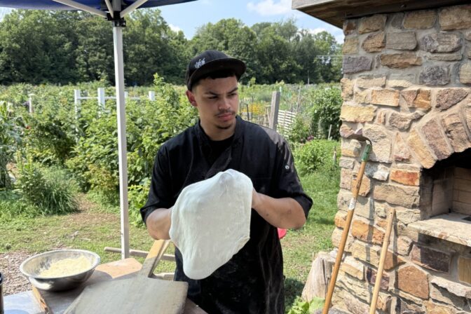 Chef Elijah Hipke making pizza