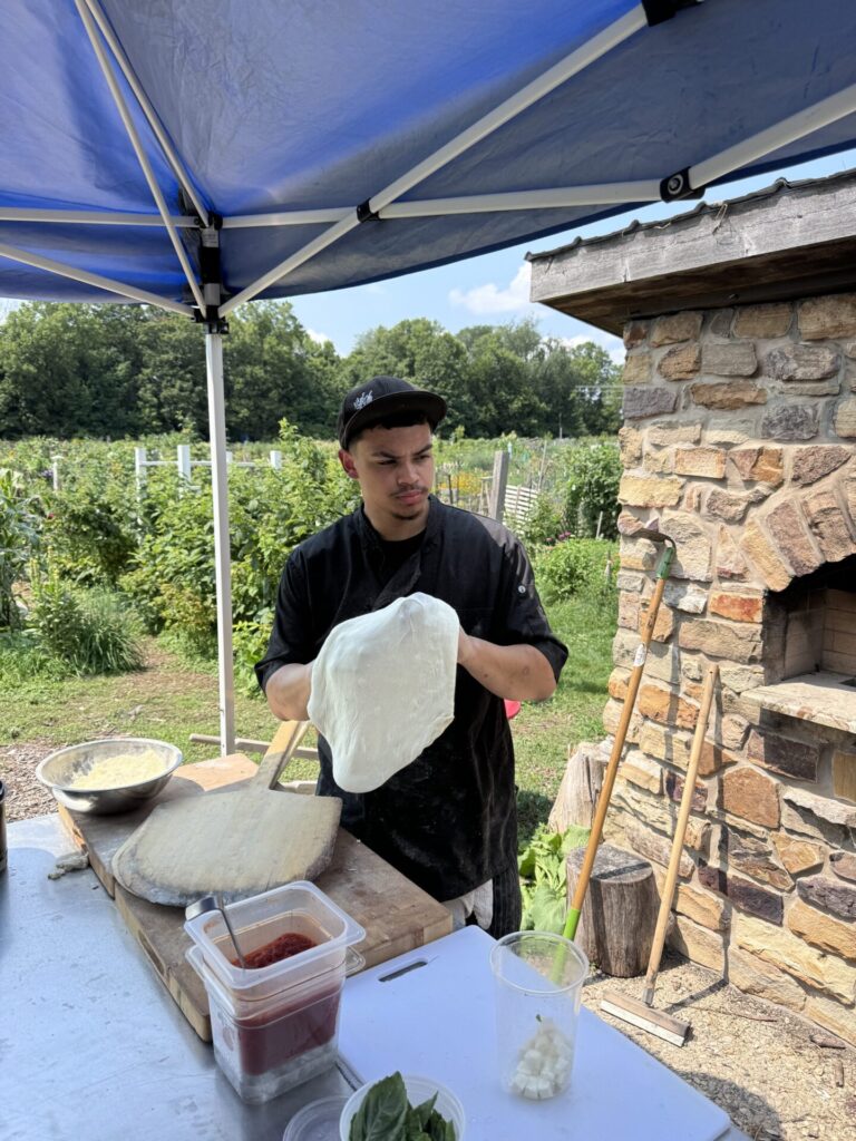 Chef Elijah Hipke making pizza